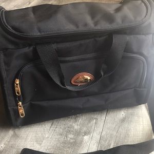 Black samsonite duffle bag with lots of pockets